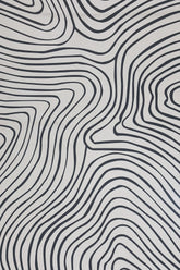 Contemporary monochrome rug with bold wave pattern.